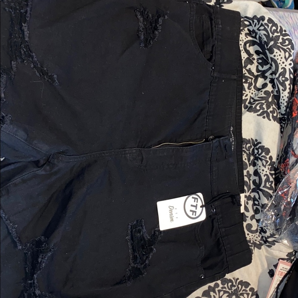 Black distressed shorts